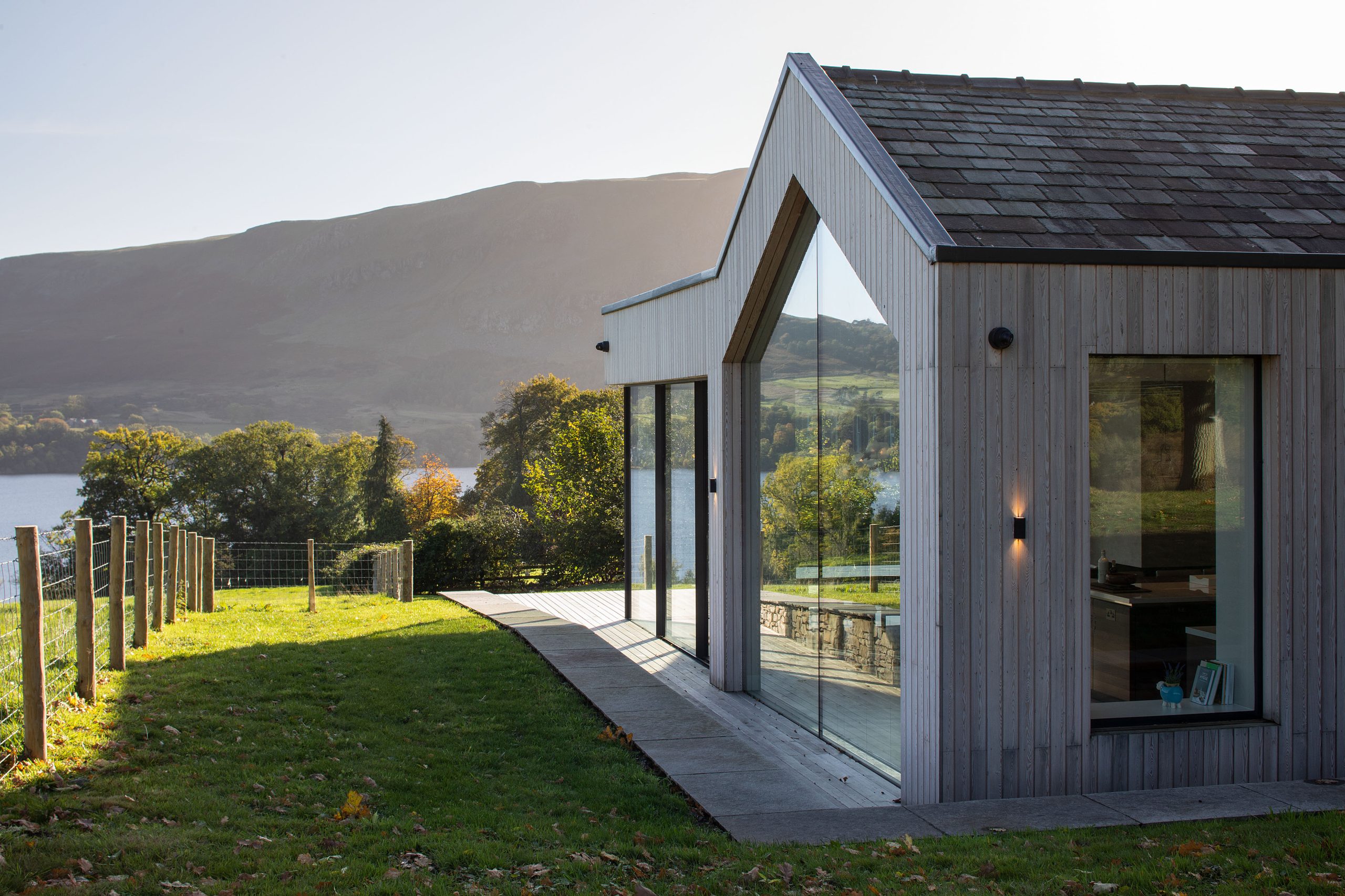 A modern build with large glass windows facing the hills. Gadsden structural engineers, Barrow-in-Furness.